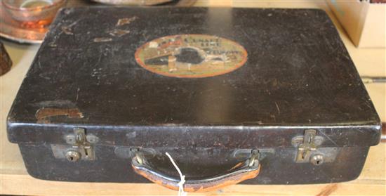 Brown leather suitcase with Cunard Line label